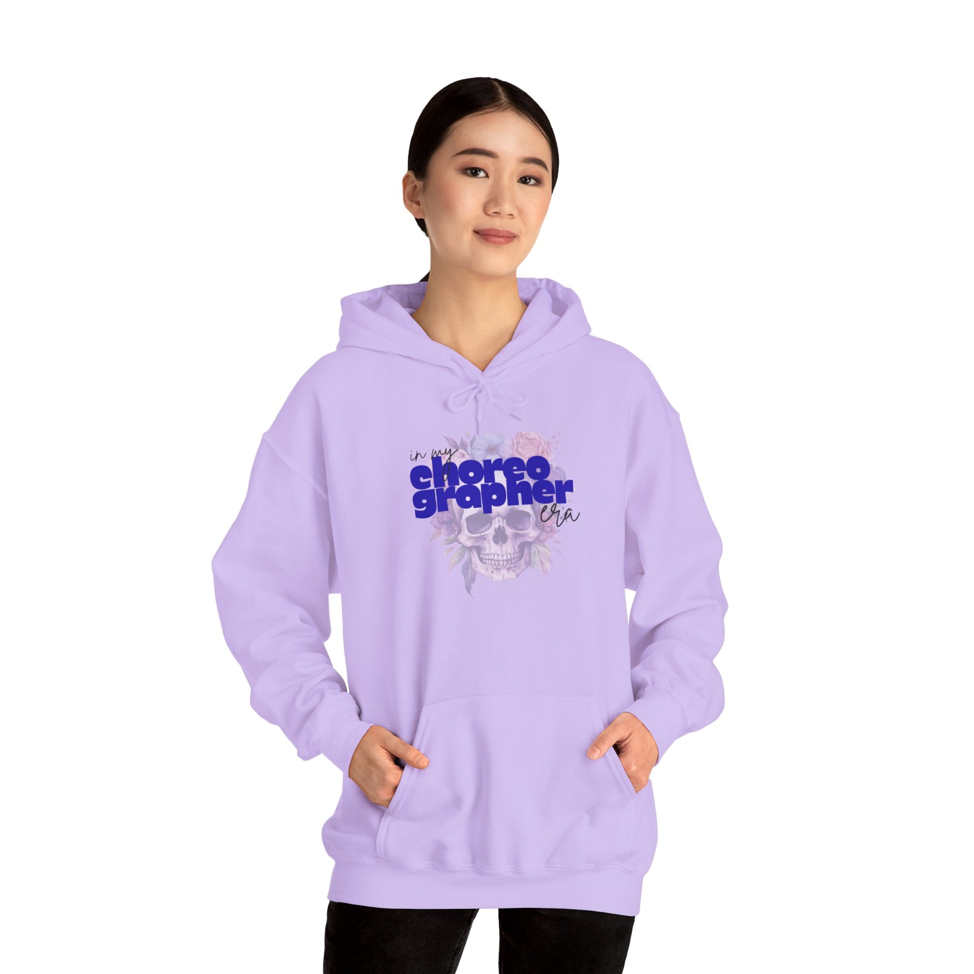 Person wearing a lavender hoodie with text design on a white background