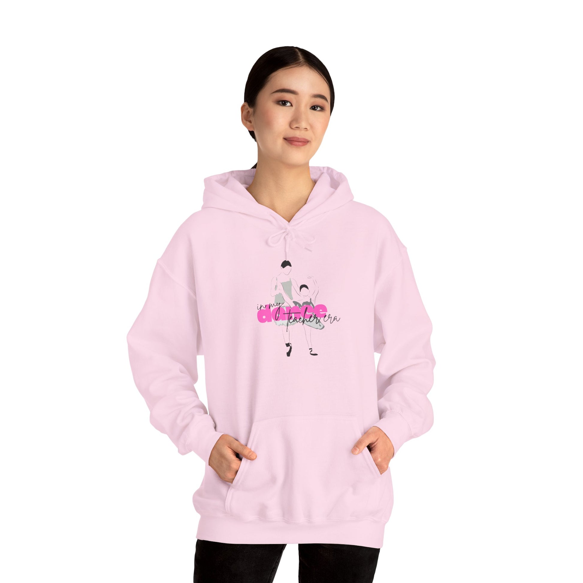 Person wearing a pink hoodie with a graphic design on a white background