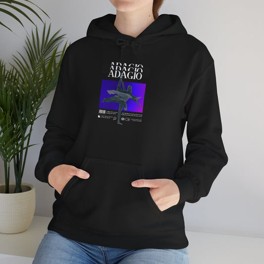 Person wearing a black hoodie with a graphic design on a neutral background