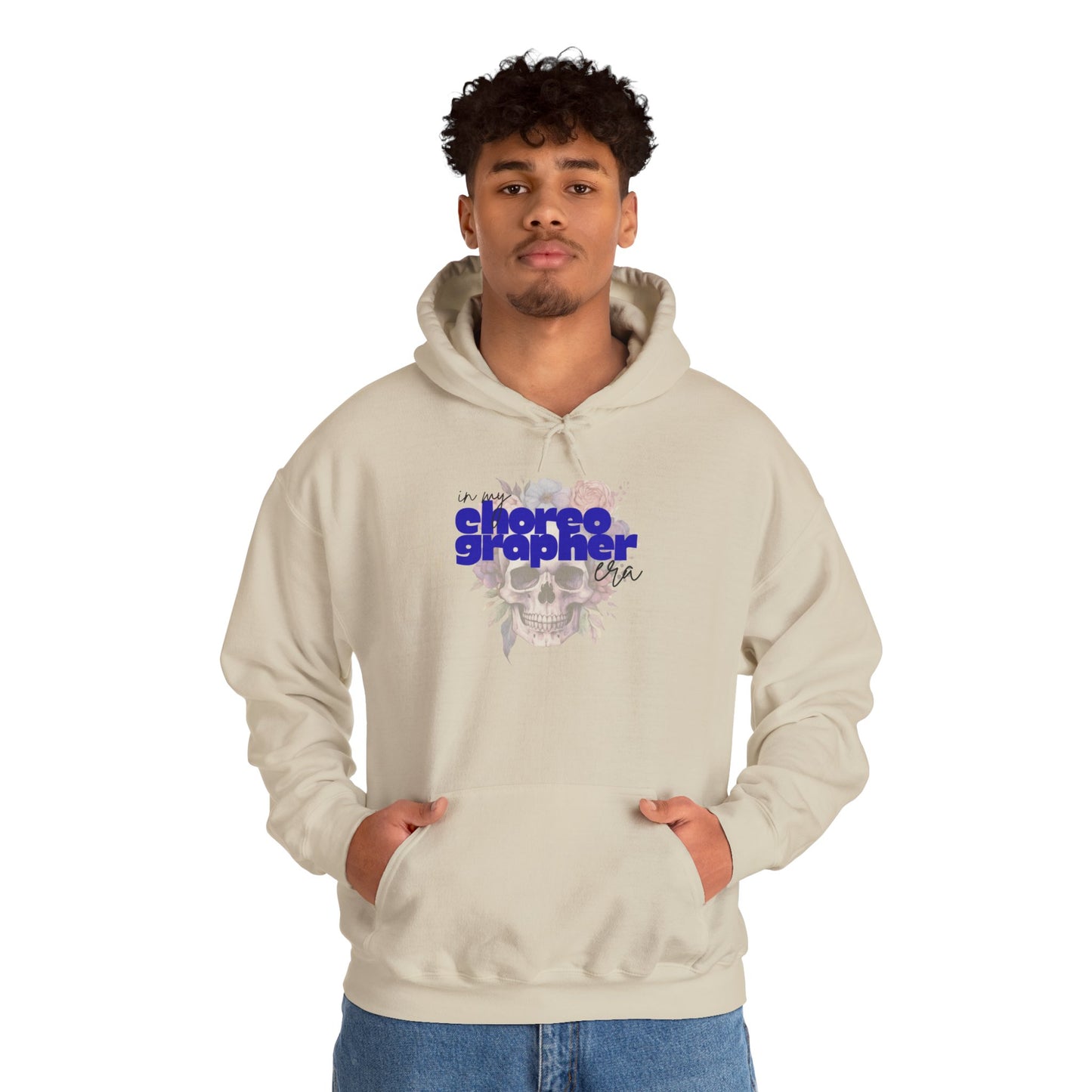 Person wearing a beige hoodie with text and graphics on a white background