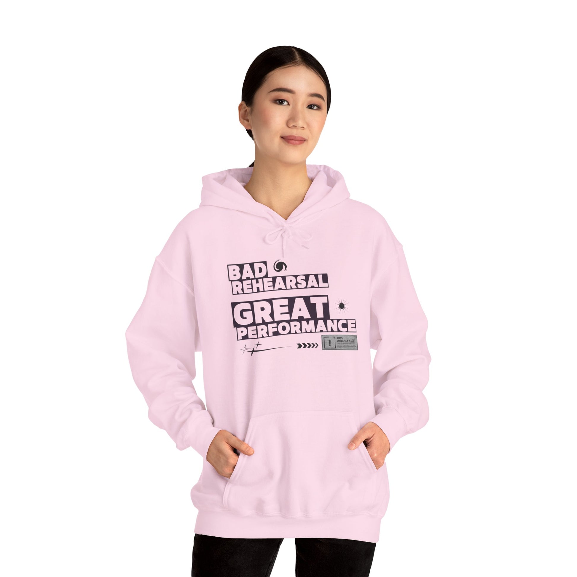 Person wearing a pink hoodie with text on a white background