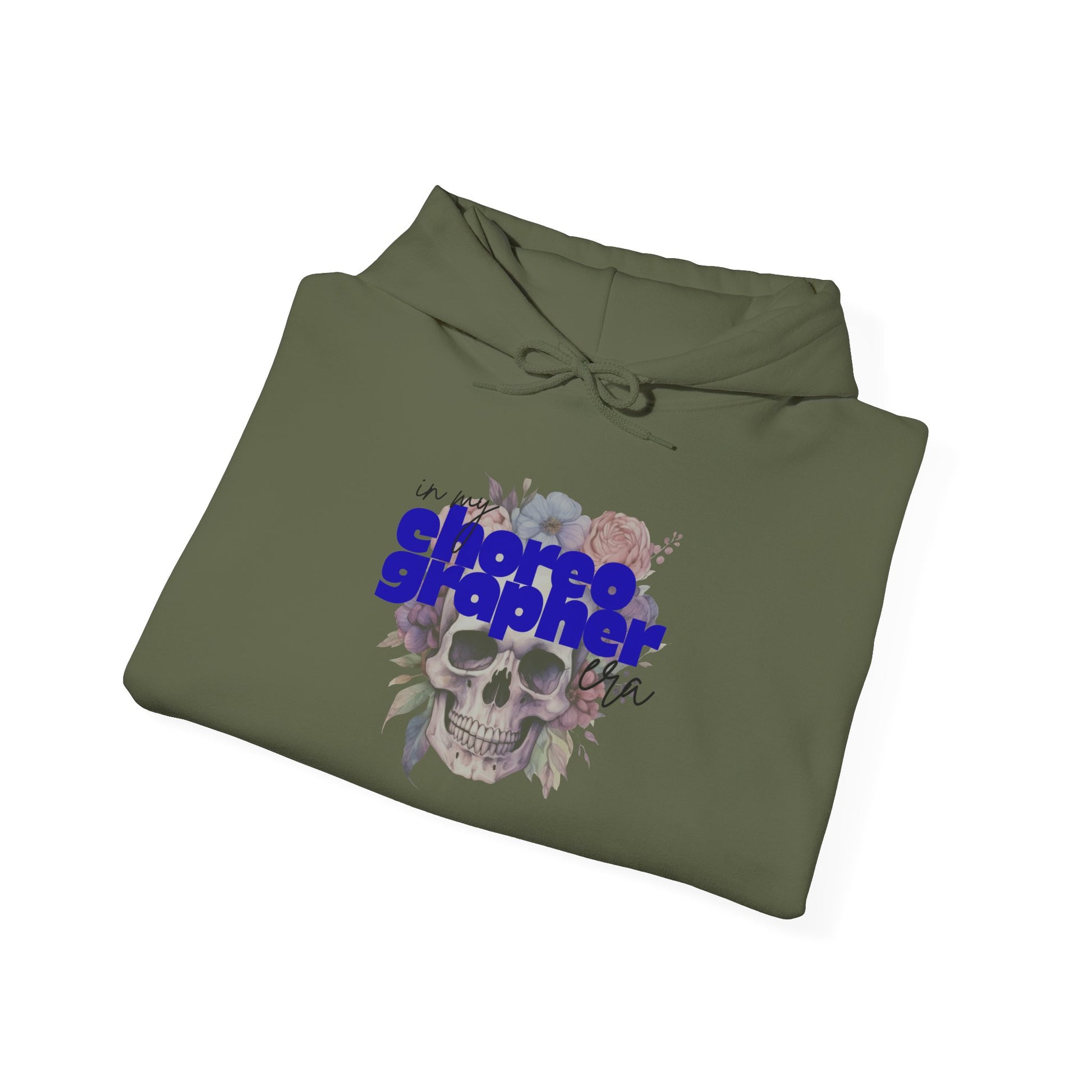 Folded green hoodie with skull and floral design on a white background