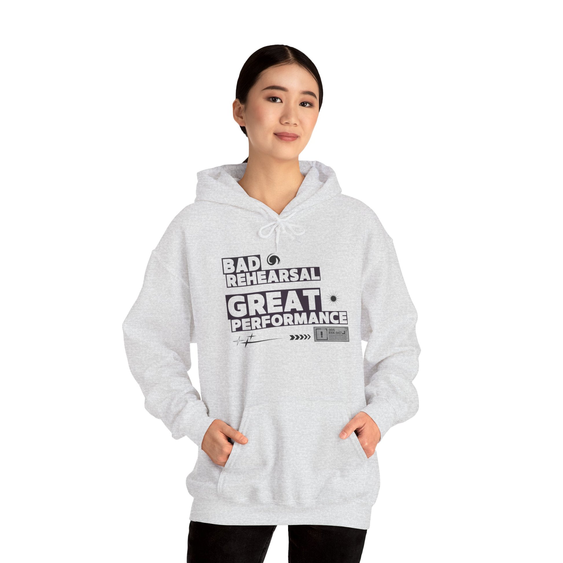 Person wearing a gray hoodie with text on a white background
