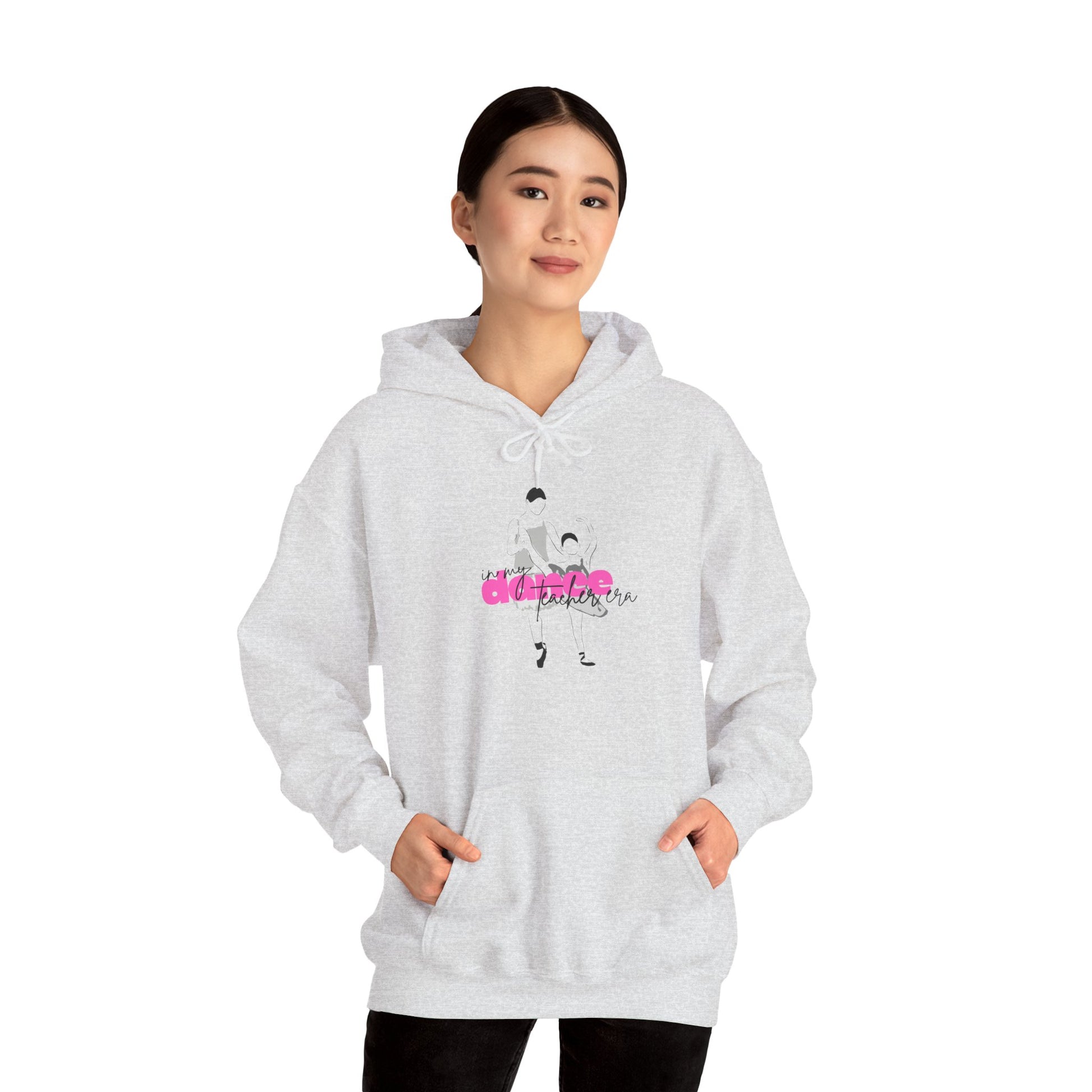 Person wearing a gray hoodie with a graphic design on a white background