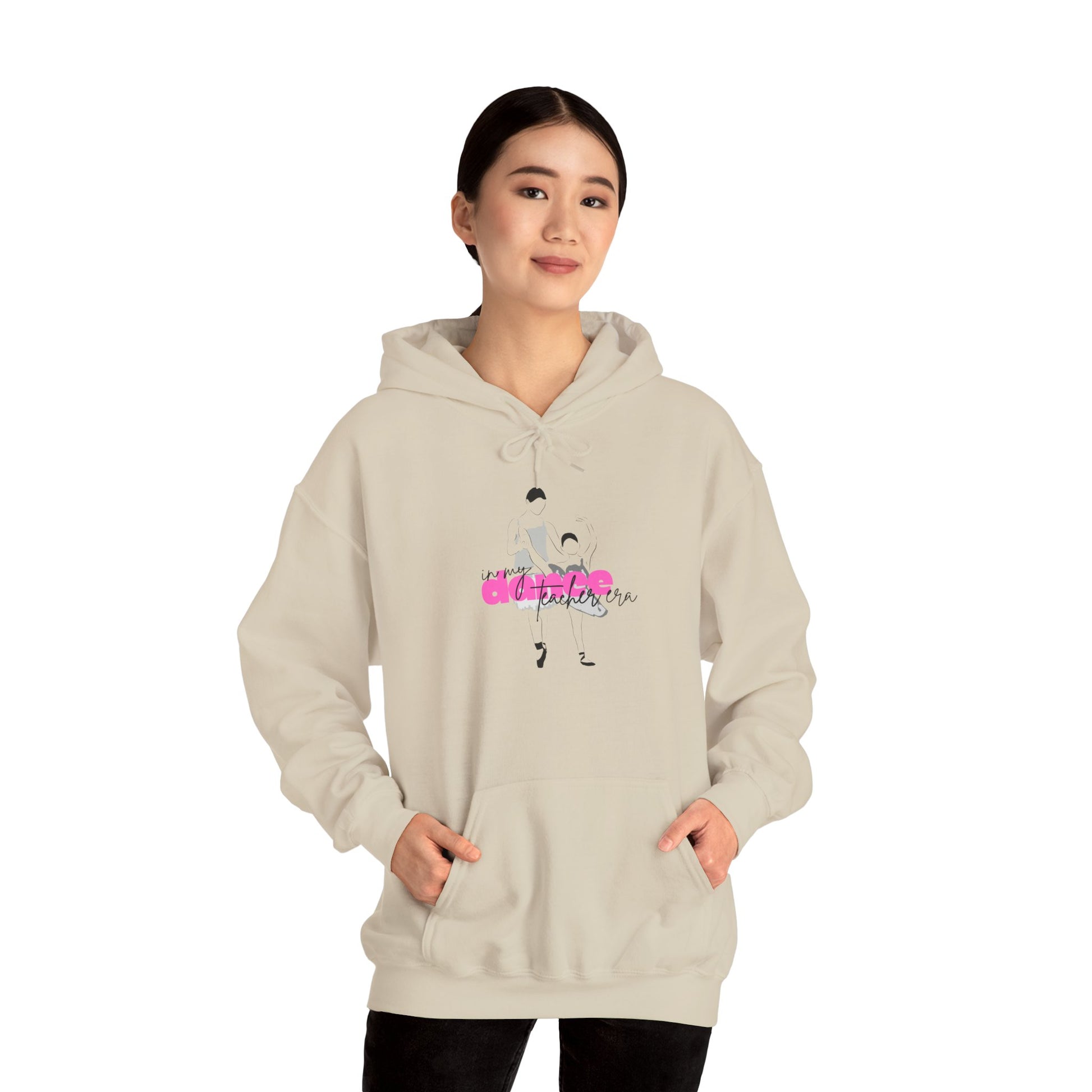 Person wearing a beige hoodie with a graphic design on a white background