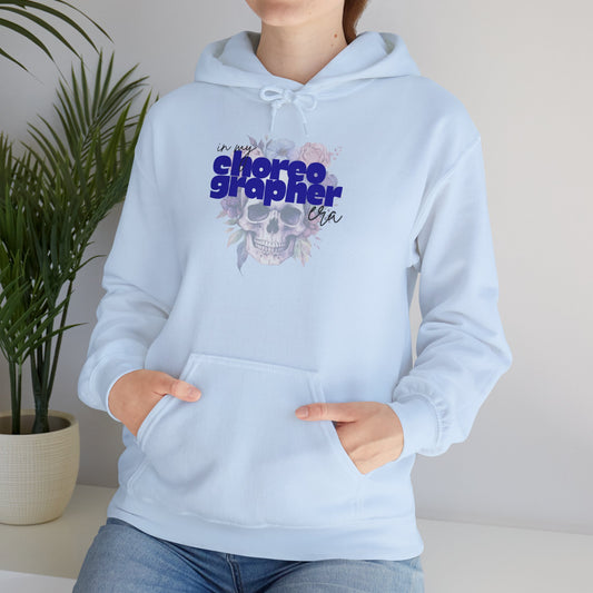 Light blue hoodie with 'I'm not a choreographer I'm a...' text and skull design, worn by a person.