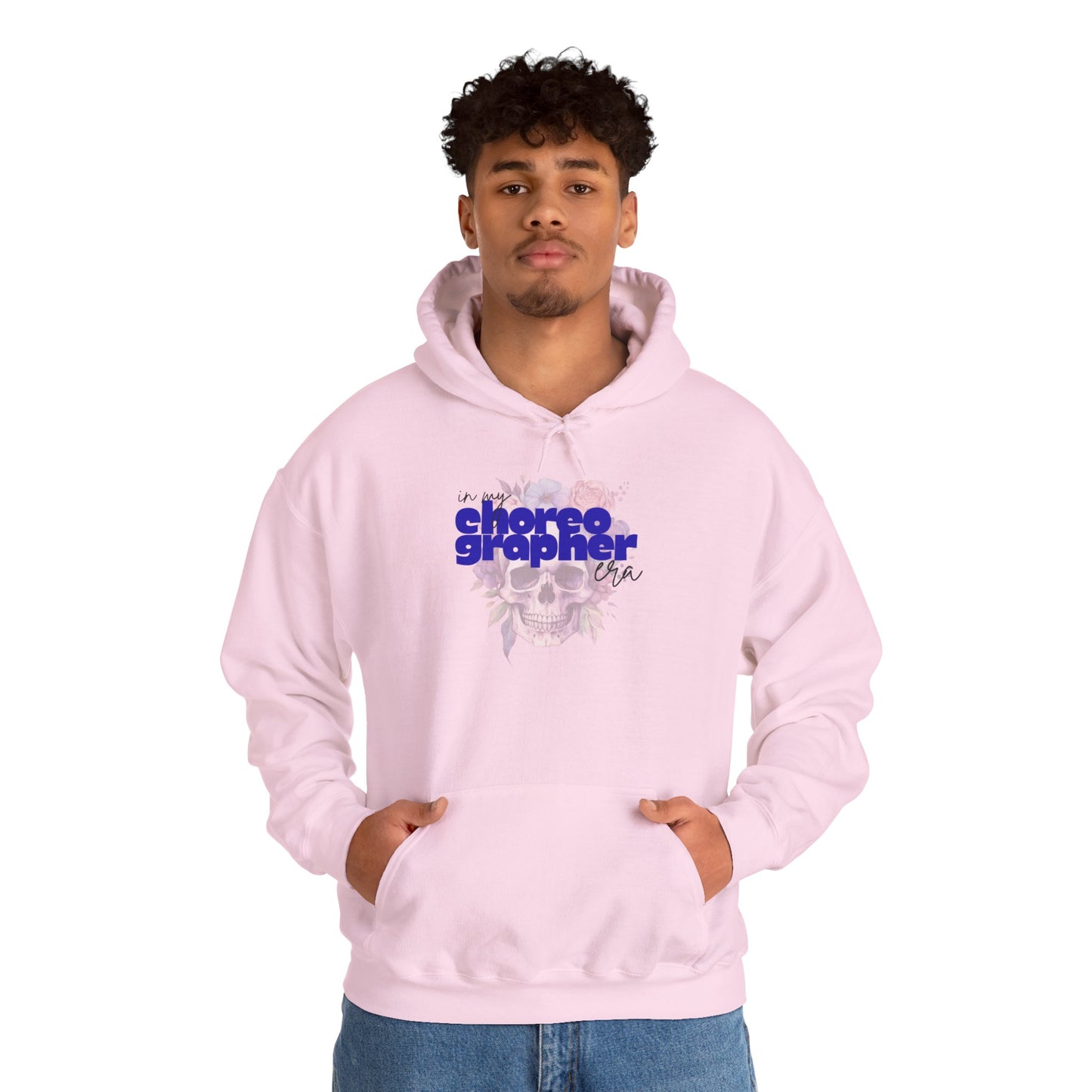 Person wearing a pink hoodie with text and graphics on a white background