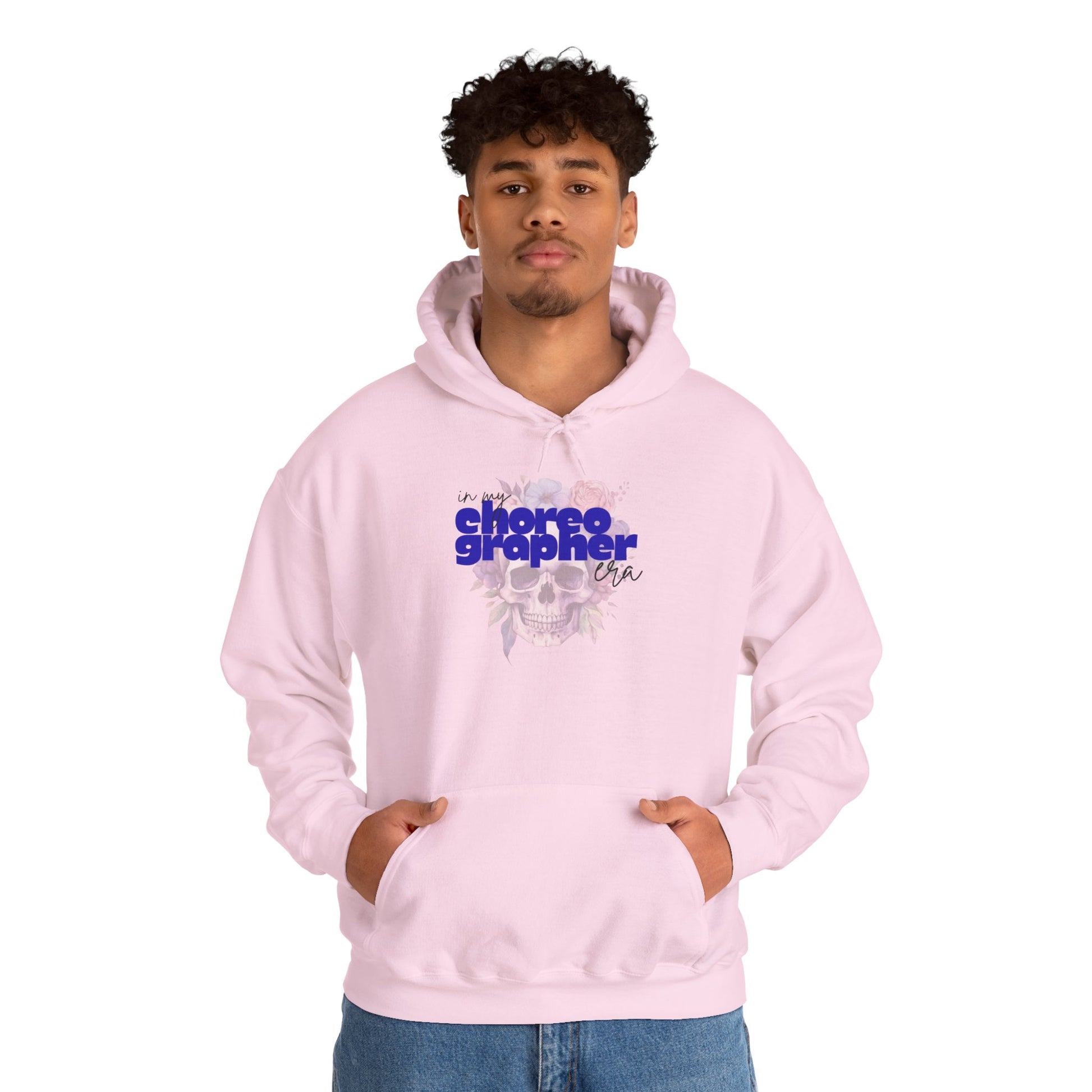 Person wearing a pink hoodie with text and graphics on a white background