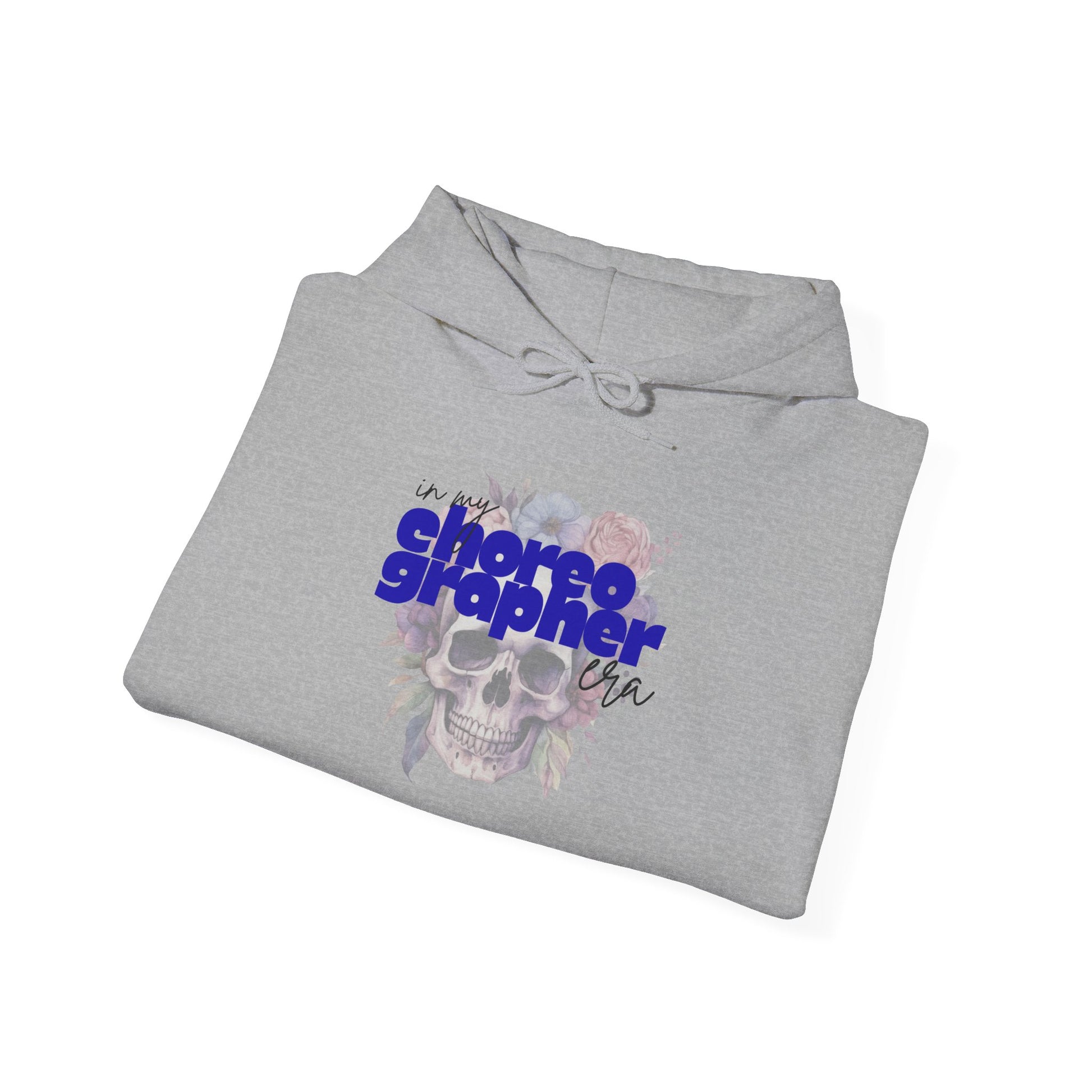 Folded gray hoodie with skull design and text on a white background