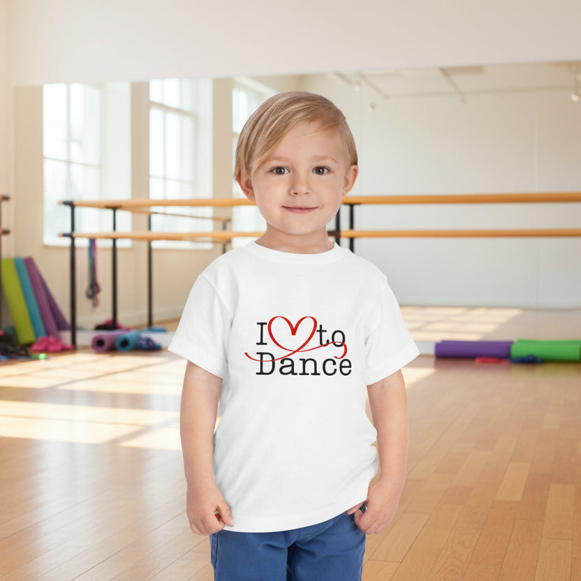 Child wearing a white t-shirt with 'I ❤️ to Dance' text 