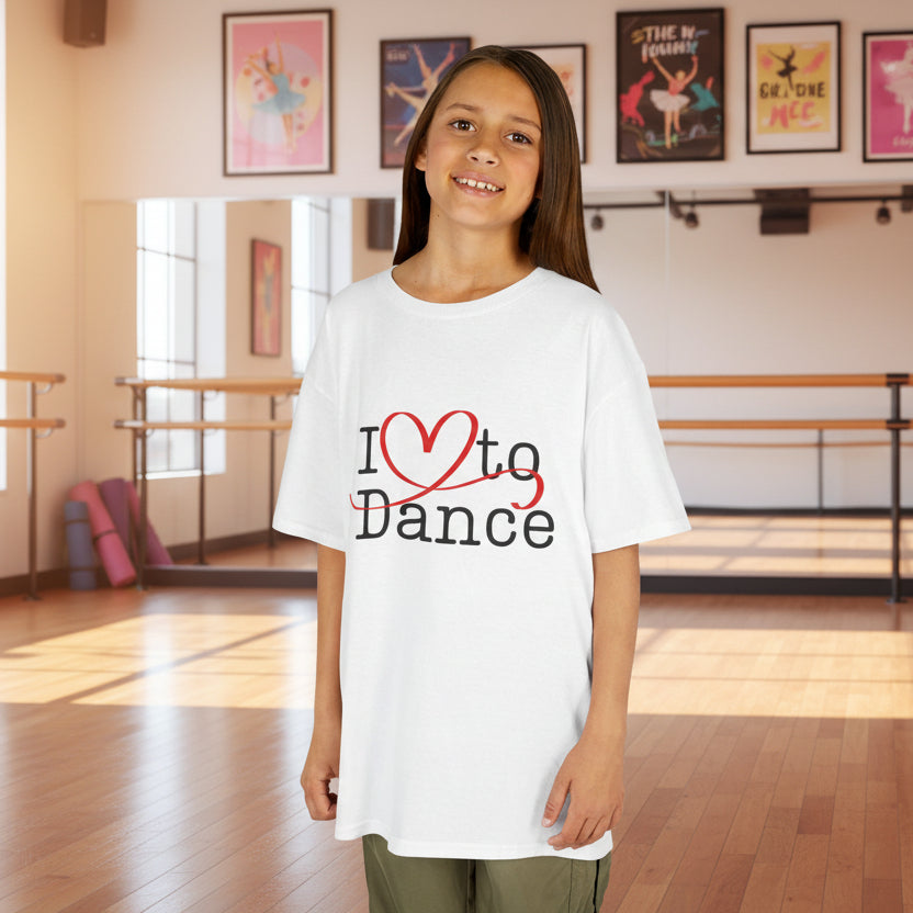 Young girl wearing a white t-shirt with 'I ❤️ to Dance' text in a dance studio