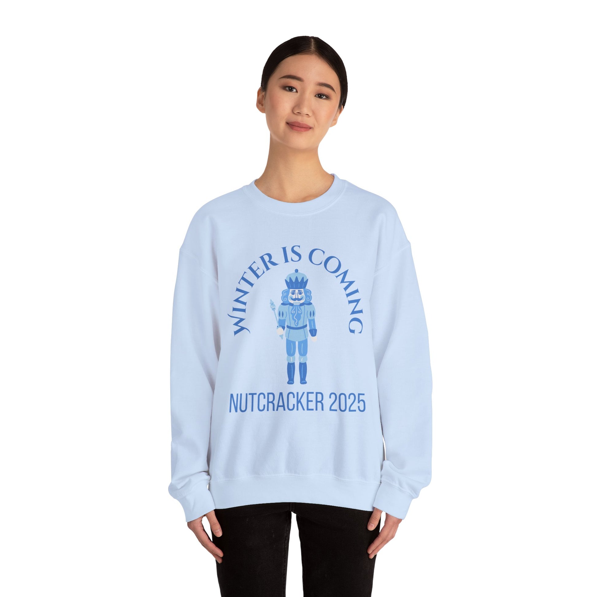 Light blue sweatshirt with Nutcracker design and text on a white background