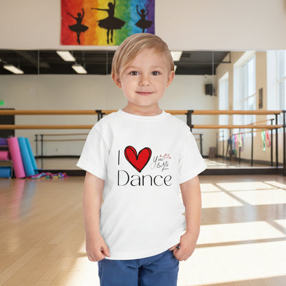 Child wearing a white t-shirt with 'I ❤️ Dance' design in a dance studio