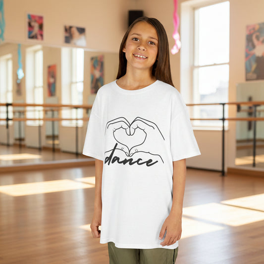 Young girl wearing a white t-shirt with 'dance' design in a dance studio