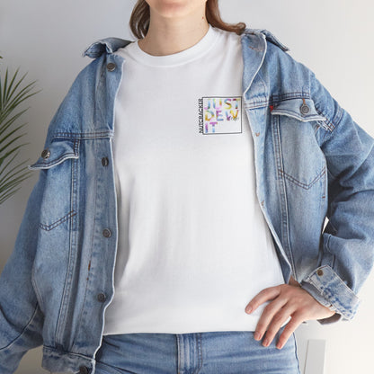 Person wearing a denim jacket over a white t-shirt with colorful text design.