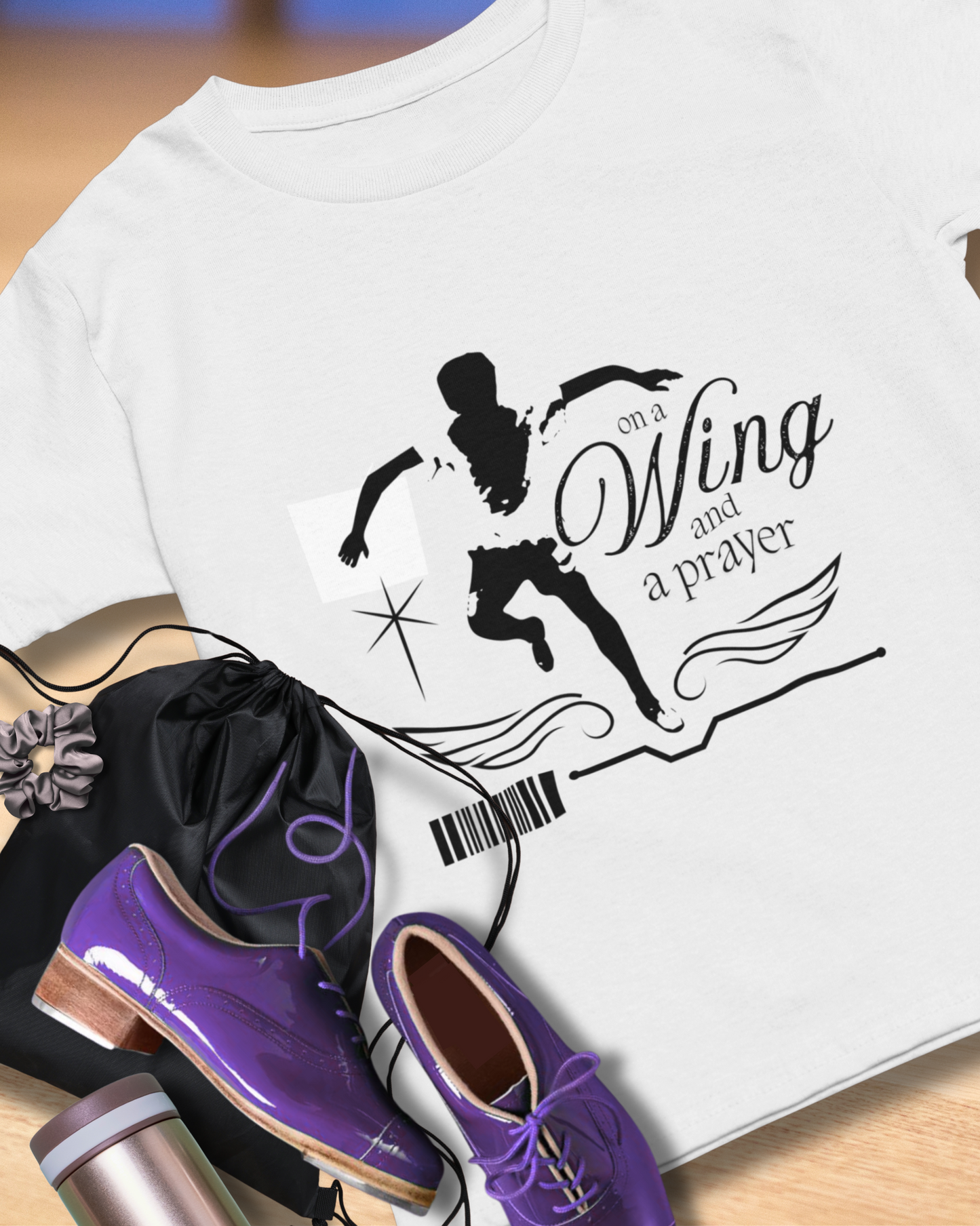 "On a Wing and a Prayer" Tap Dance Tee – Unisex Heavy Cotton T-Shirt with Streetwear-Inspired One-Footed Wing Dancer Graphic